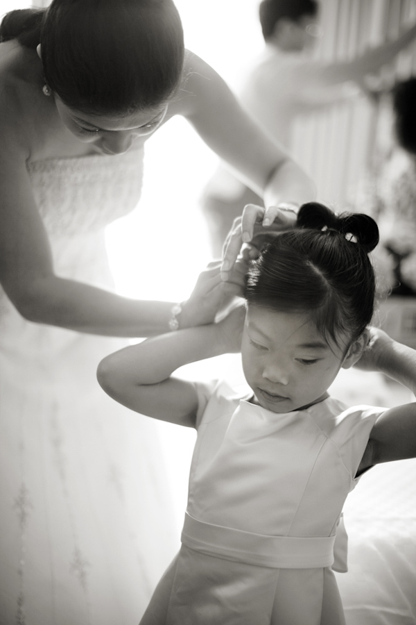 Adorable girl getting her hair fixed - wedding photo by Melissa Jill Photography